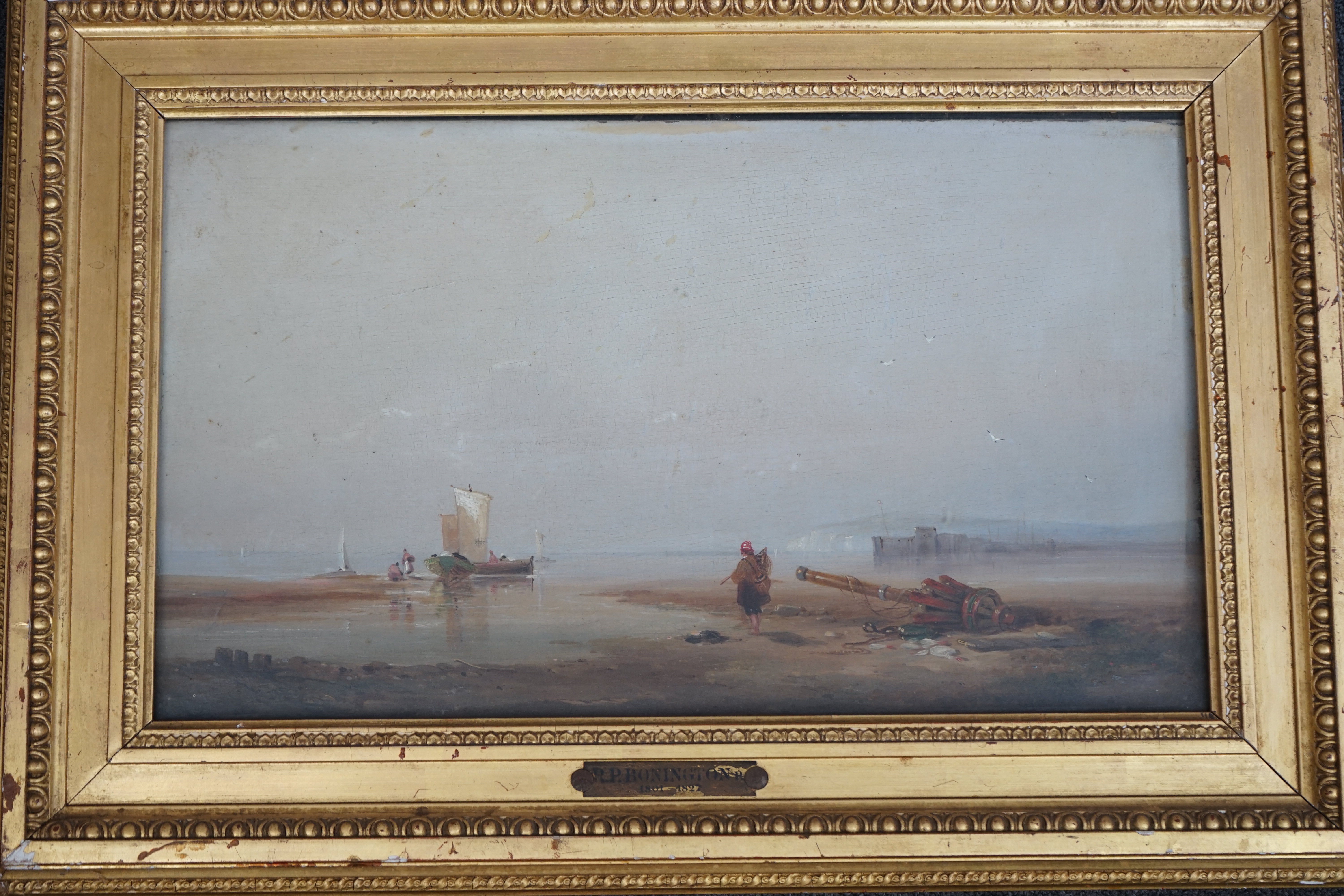 Circle of Richard Parkes Bonington (English, 1802–1828), Fisherfolk on the shore at low tide, oil on wooden panel, 28 x 46cm